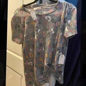 “You never know” top—- size small. Never worn still with tags & true to size!